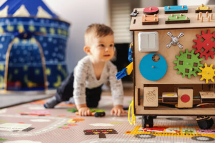 Adorable toddler playing interactive games for good development